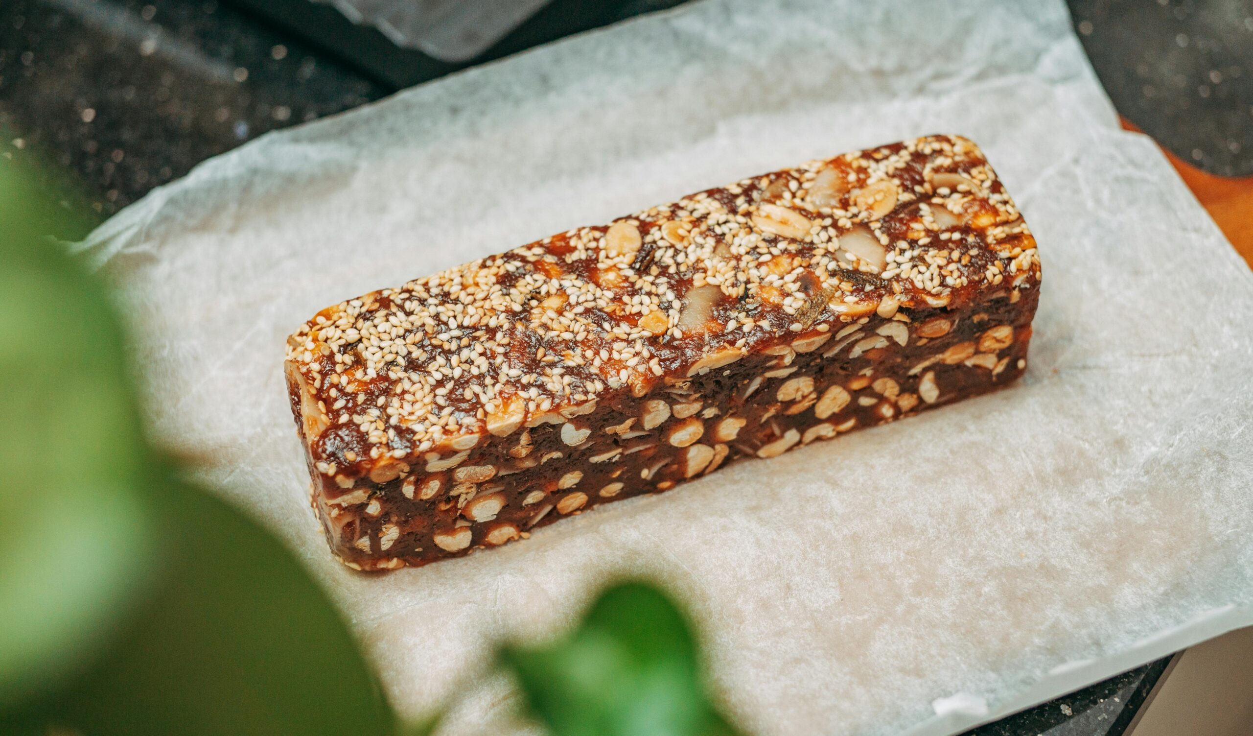 Enjoying a protein bar as a healthy snack option, emphasizing convenience and benefits.