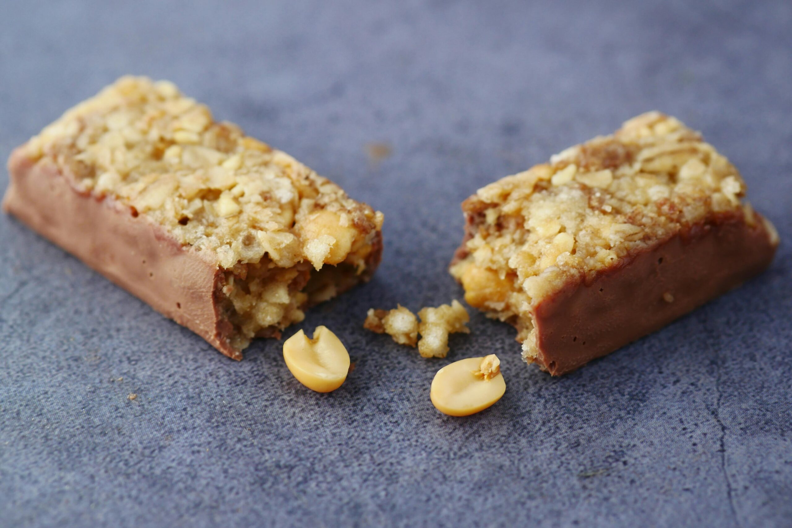 A protein bar on a table, split to show contents